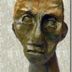 Bronzeskulptur eines menschlichen Kopfes mit ausdrucksstarkem Gesicht | Bronze sculpture of a human head with expressive face