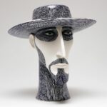 sculpture_of_a_male_head_with_a_long_neck_and_a_hat_porcelain_f9016455-abc1-4571-a75b-7ce9e6cb580d_0.png1774401327806